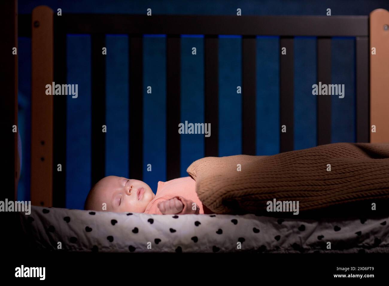 Infant sleeping in crib hi-res stock photography and images - Alamy