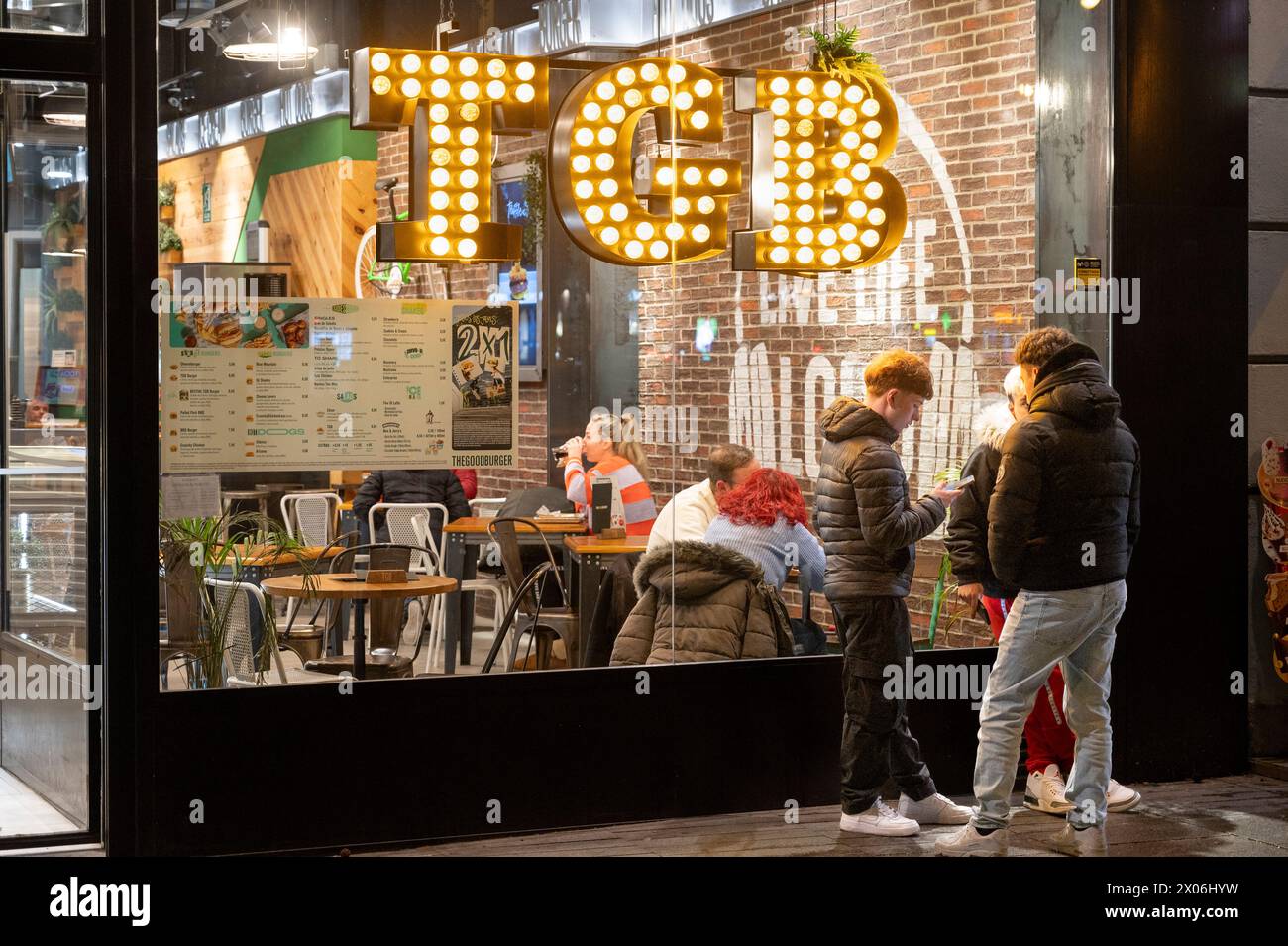 Madrid, Spain. 08th Apr, 2024. People stand outside the Spanish fast