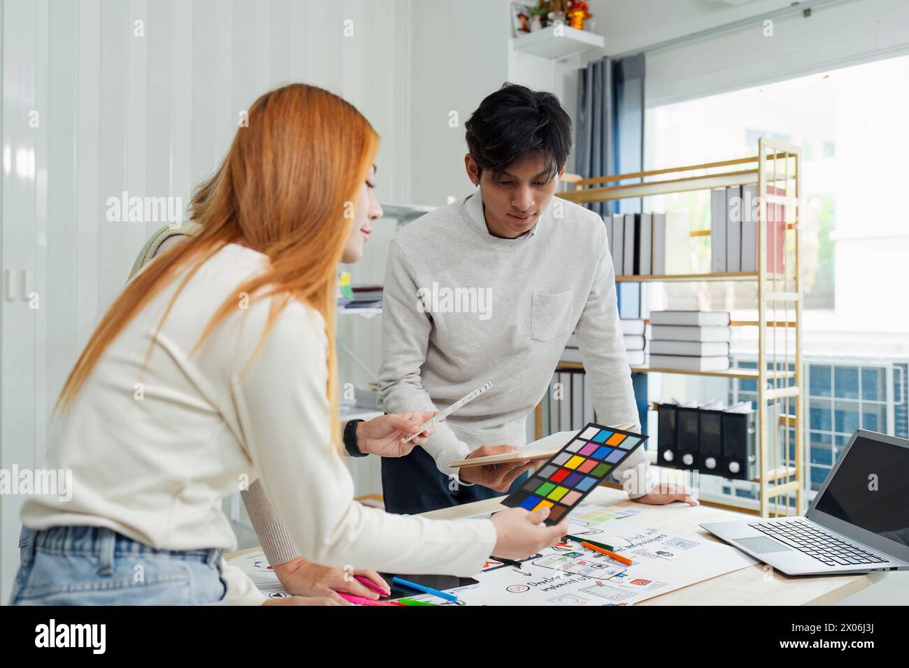 team of UI UX web designer are working together to develop mobile ...