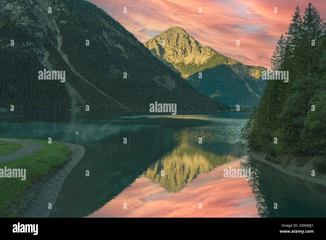 The Thaneller is reflected in Lake Heiterwanger, Austria, Tyrol Stock Photo