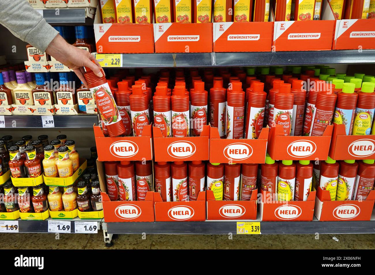 Squeeze bottles Curry Ketchups in a grocery Stock Photo