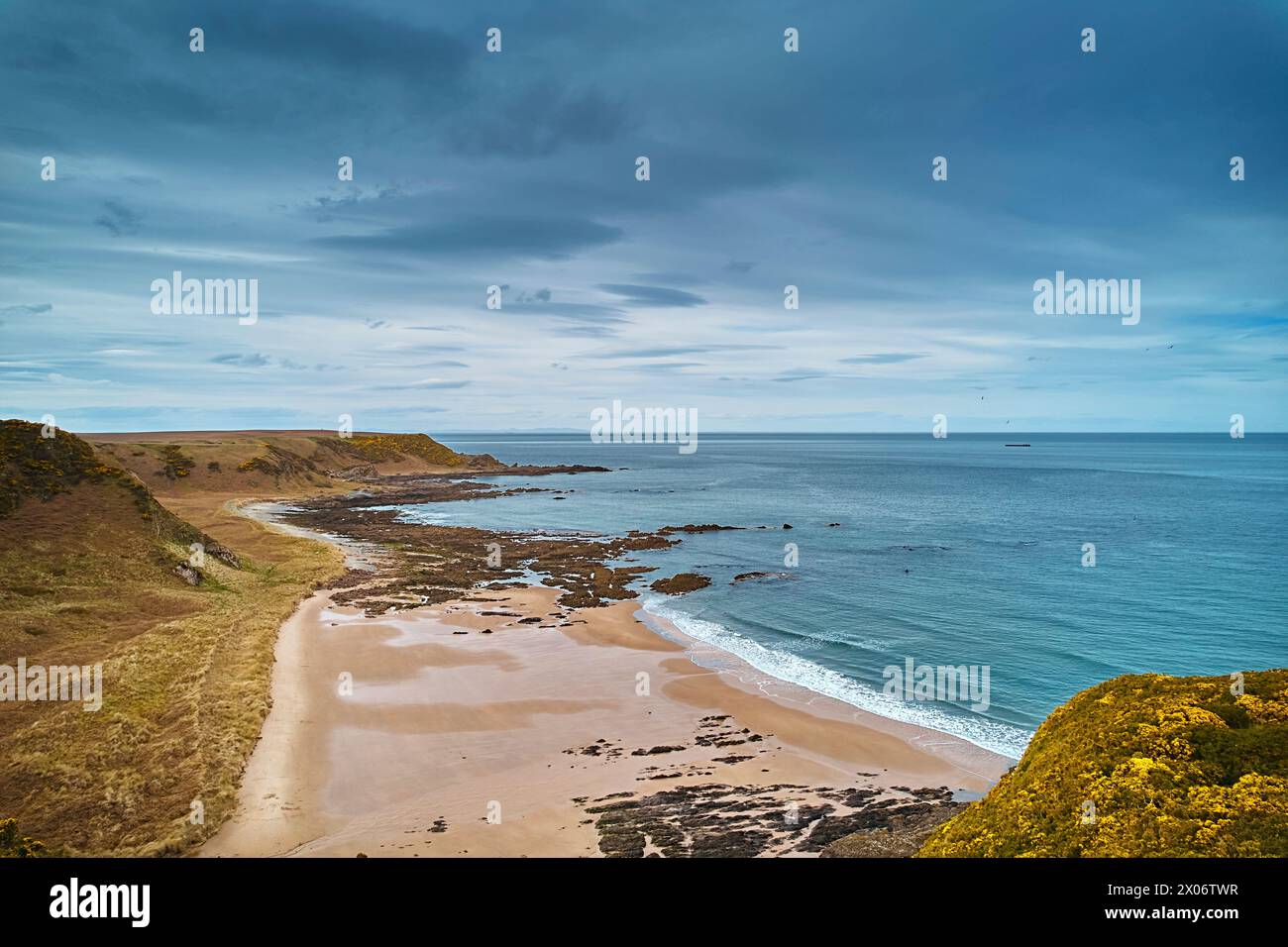 Sunnyside Beach Cullen Scotland sandy beach with rocks and the Moray Firth with a calm sea Stock Photo