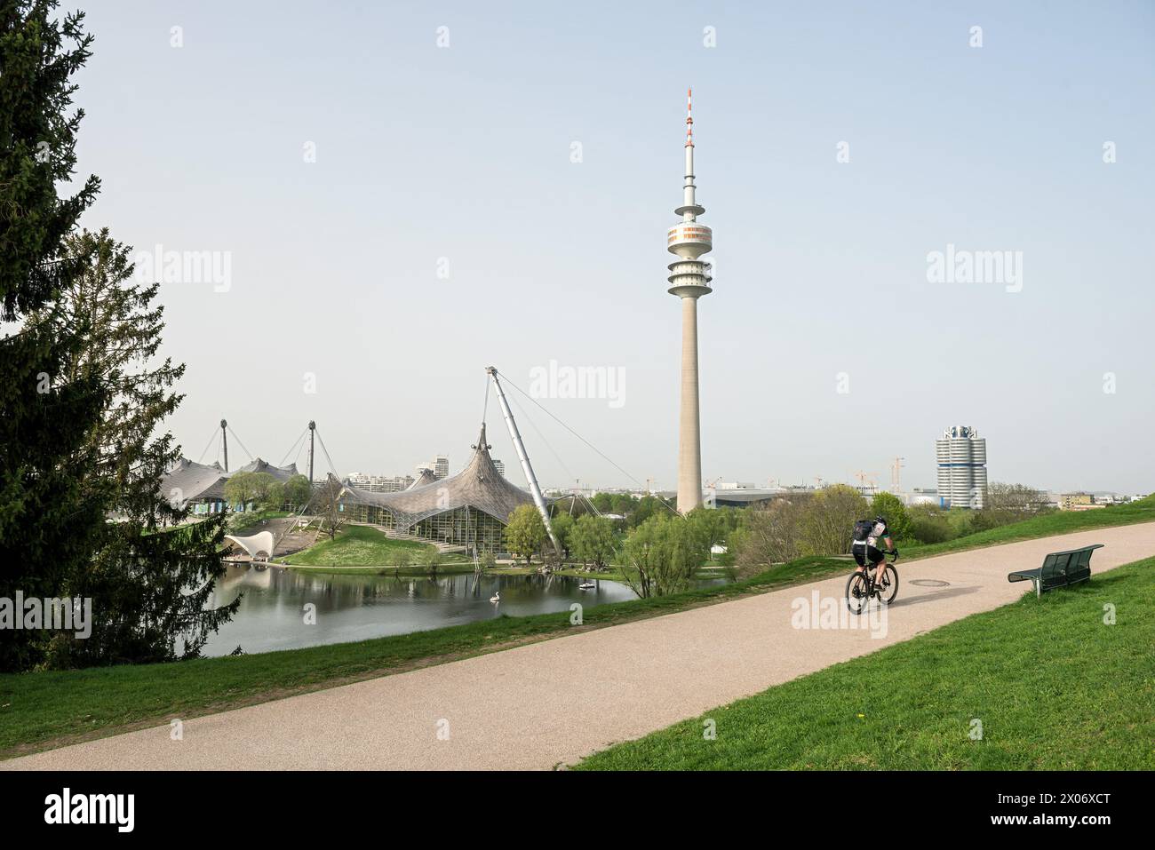 Olympiapark München, Olympiaturm mit Radfahrer Stock Photo