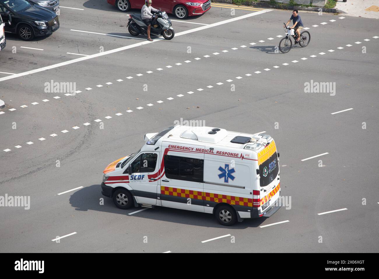 Aerial view of an ambulance on the road to a nearby hospital. Singapore. Stock Photo