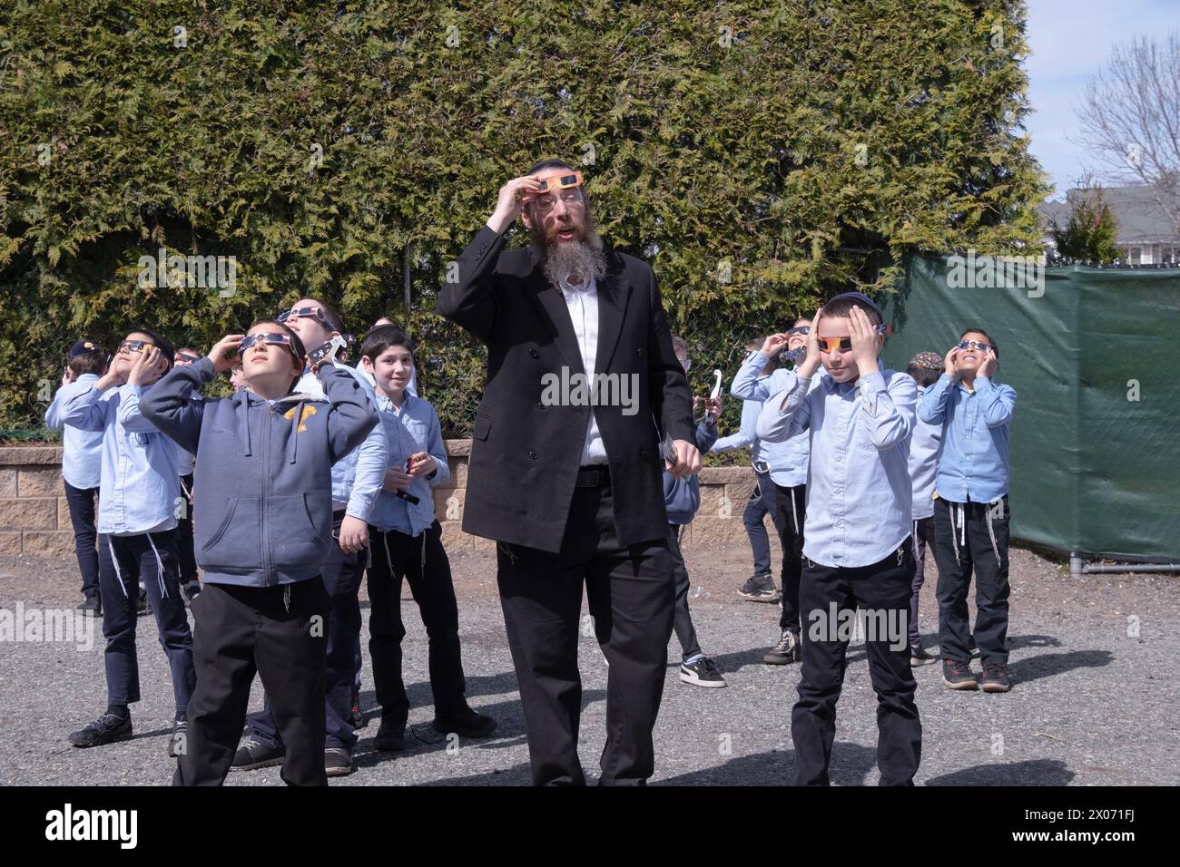 Jewish yeshiva students & their Rabbi teachers watch the 2024 solar