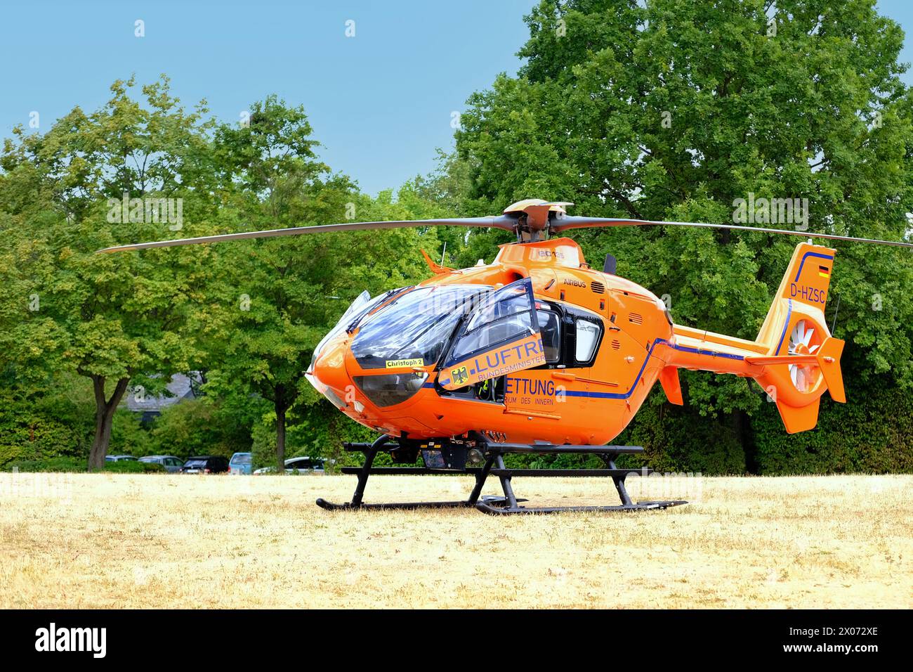 orange medical helicopter, Eurocopter before take-off, crew is preparing emergency aircraft, Air medical services, Rapid Response Vehicles, intensive Stock Photo