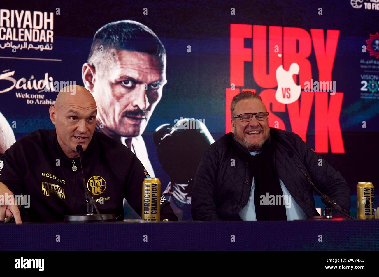 Tyson Fury and manager Spencer Brown during a press conference at the The Mazuma Mobile Stadium, Morecambe. Tyson Fury faces Oleksandr Usyk in the 'Ring of Fire' undisputed world heavyweight title fight in Riyadh, Saudi Arabia on 18 May 2024. Picture date: Wednesday April 10, 2024. Stock Photo