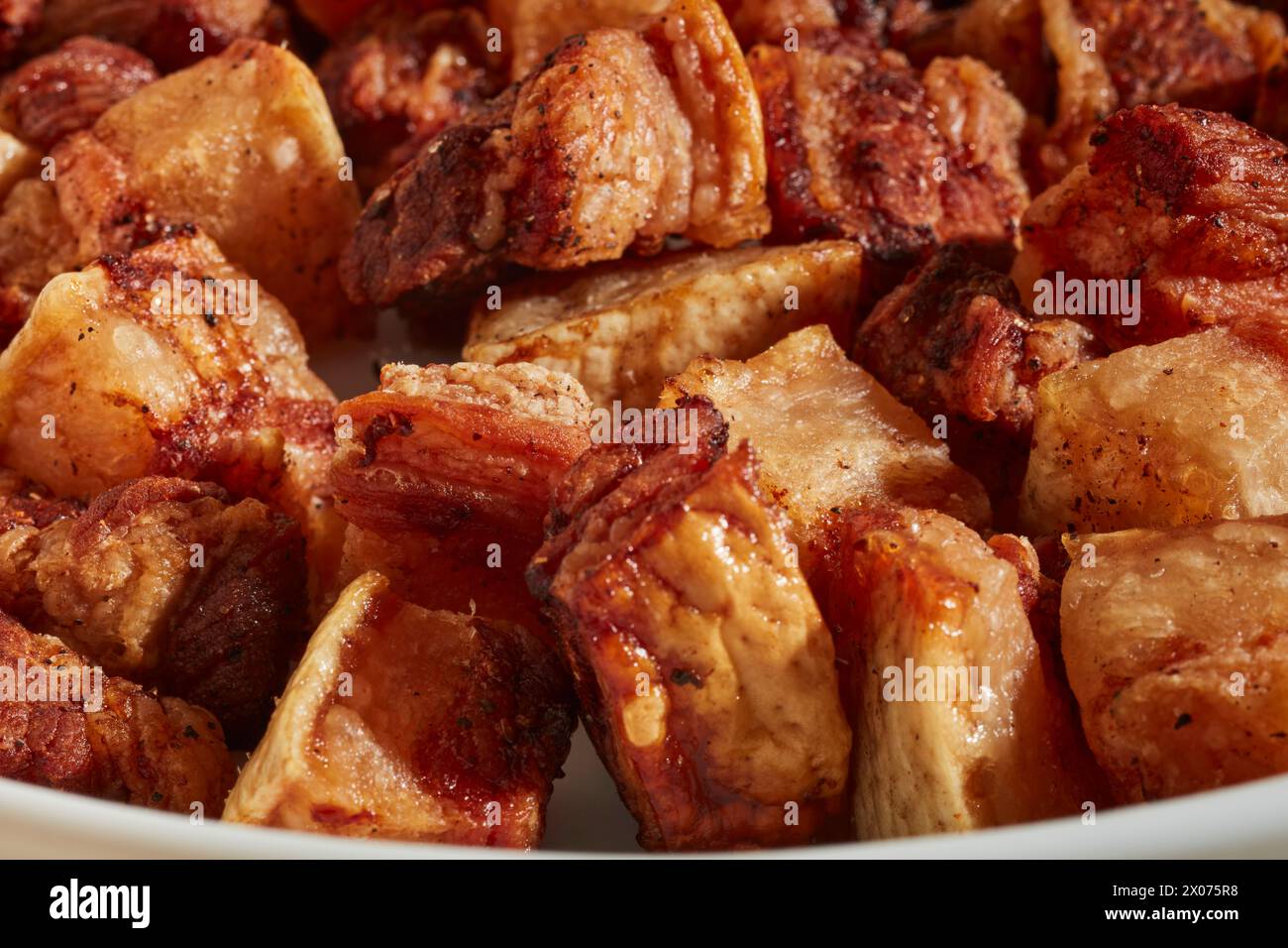 Cubes of cooked pork belly made in an air fryer Stock Photo Alamy