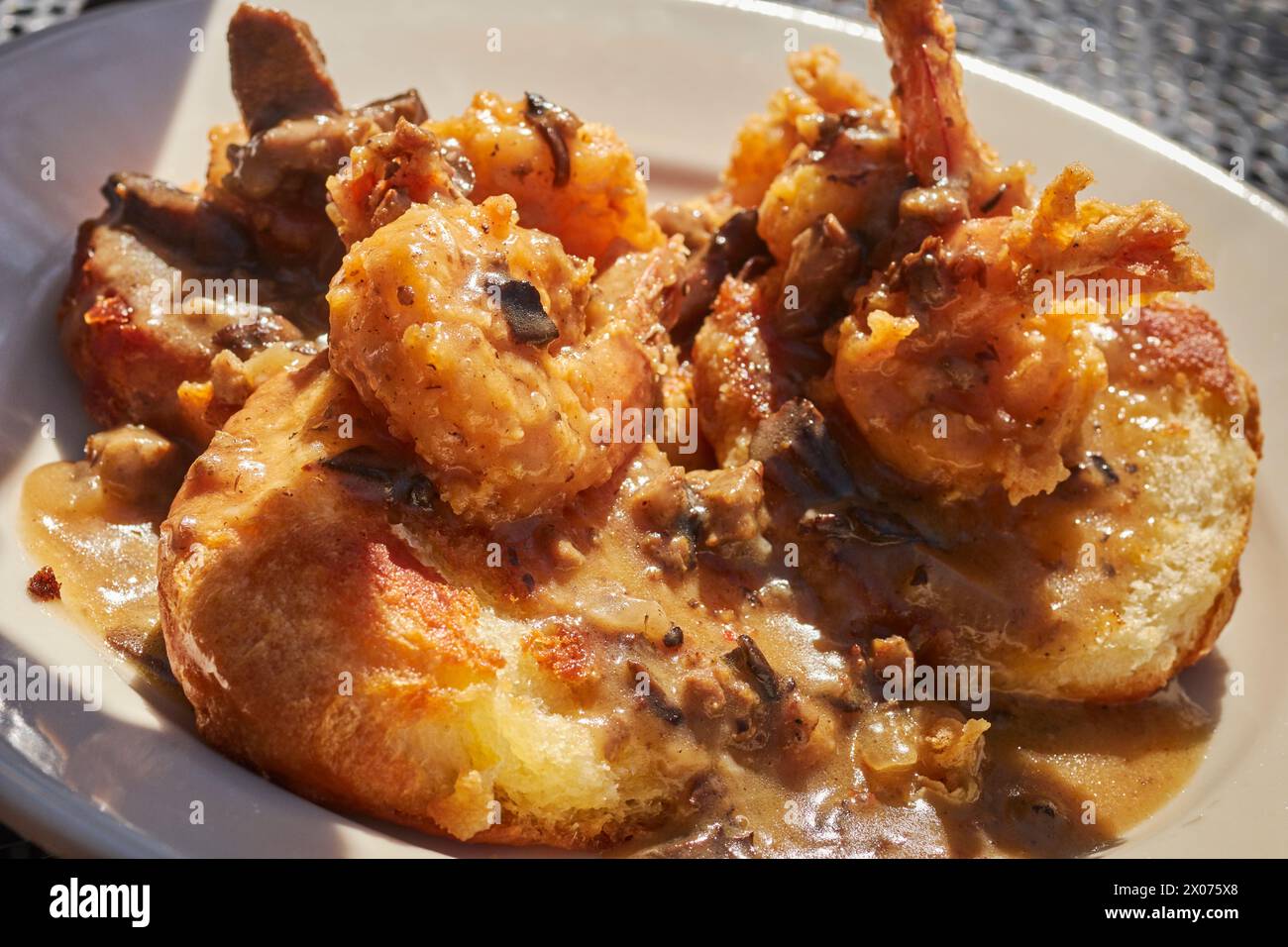 Shrimp, biscuits, and gravy. A classic of Gullah Getchee cuisine served in the Low Country near Beaufort, South Carolina Stock Photo