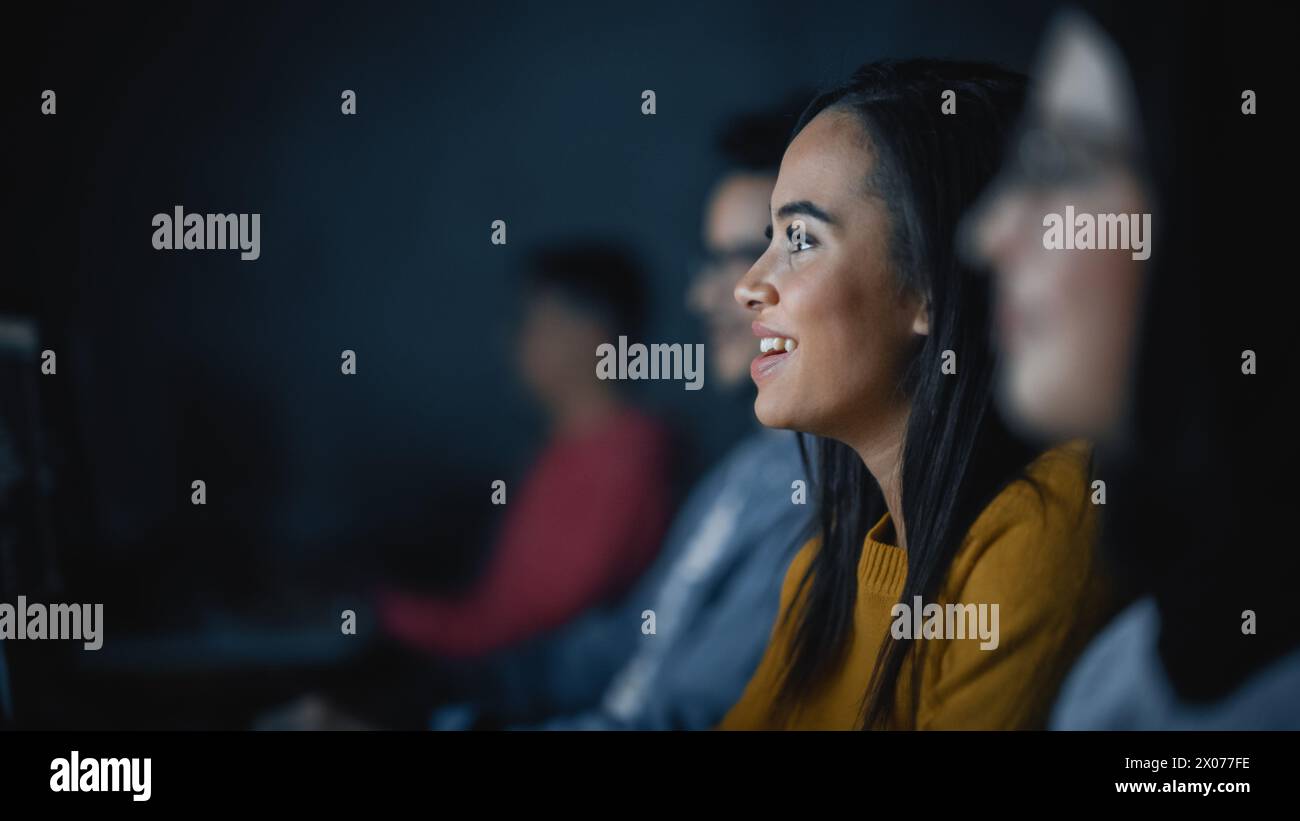 Diverse Multiethnic Group of Female and Male Students Sitting in College Room, Collaborating on School Projects on a Computer. Young Scholars Study, Talk, Apply Academic Skills and Knowledge in Class. Stock Photo
