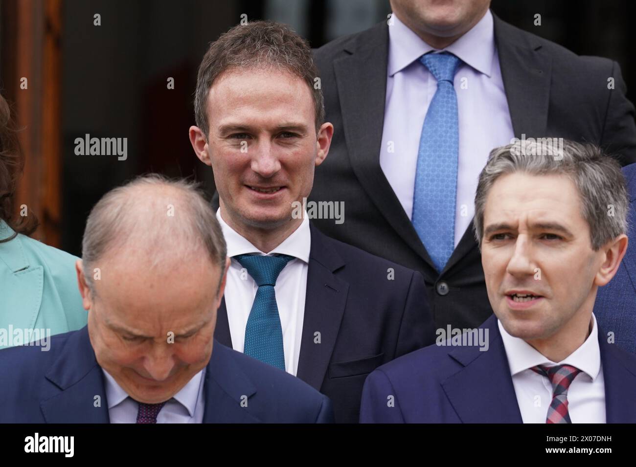Alan Dillon (centre) who has been appointed Minister of State in Taoiseach Simon Harris' (right) cabinet during a photocall with fellow appointed Ministers of State on the steps of the Government Buildings in Dublin. Picture date: Wednesday April 10, 2024. Stock Photo