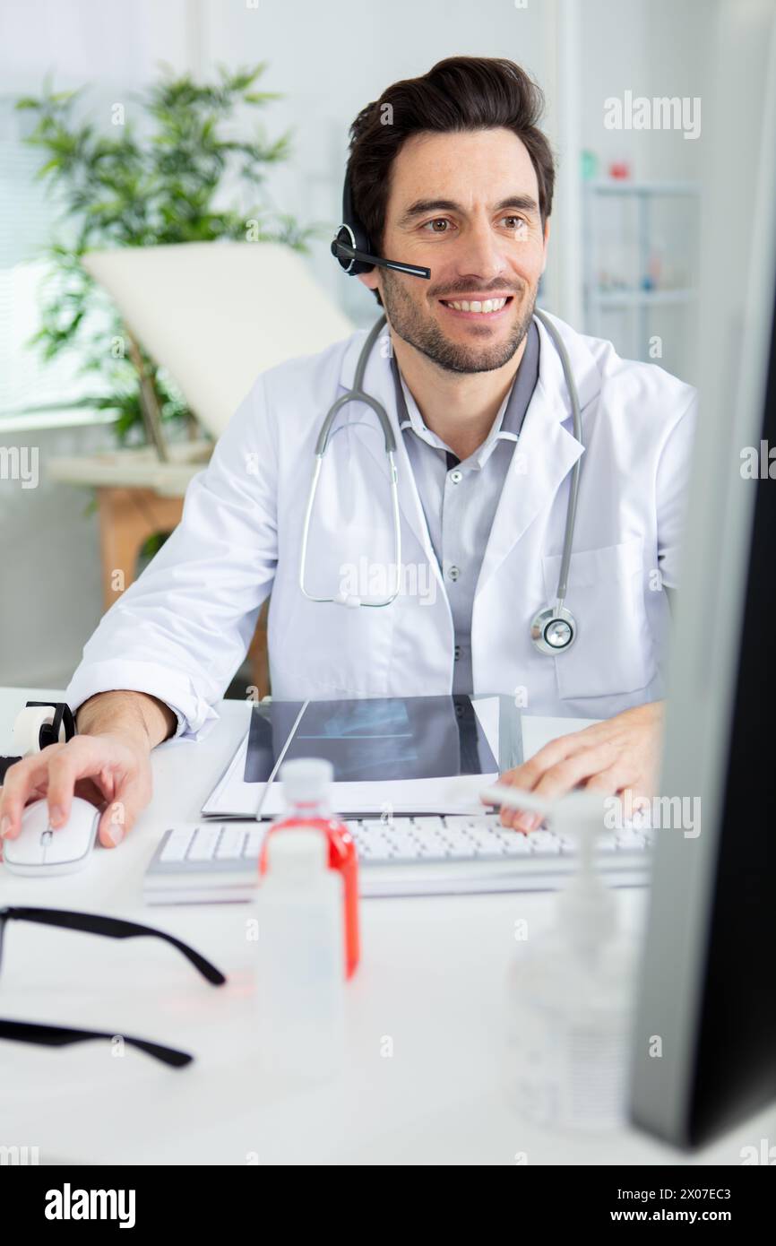doctor having video conference on laptop Stock Photo