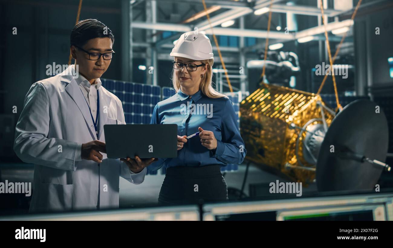Engineer and Technician Working on Satellite Construction. Aerospace ...