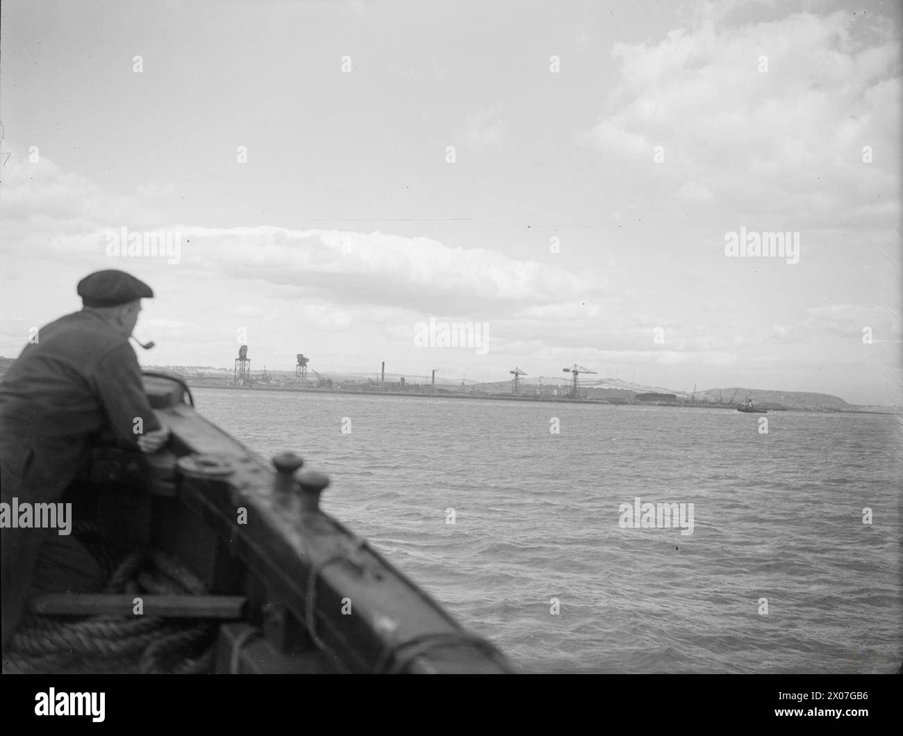 AT ROSYTH ROYAL NAVAL DOCKYARD, 11 AUGUST 1944. View of the dockyard from across the Forth