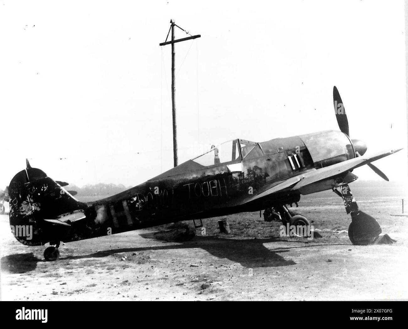 THE ROYAL AIR FORCE IN BRITAIN 1940-1945 - Original wartime caption: During the night of the 16th July 1943 when a small force of German FW.190 fighter-bombers attempted to attack London, one of the raiders landed at an R.A.F. airfield. The Fw.190 which landed at West Mailing, R.A.F. Station. Photographic negative , Royal Air Force Stock Photo