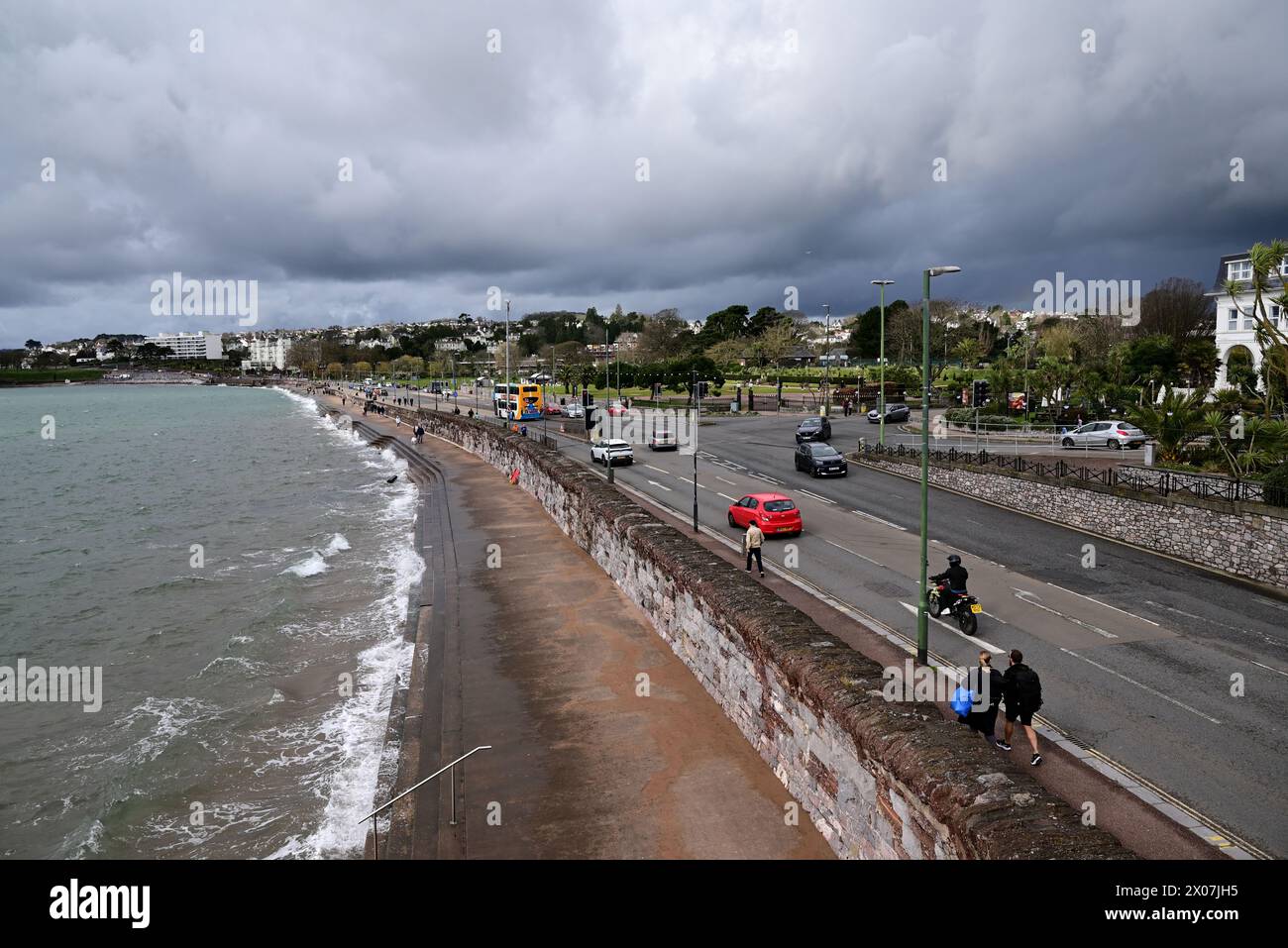 Sunshine and dark clouds over Torquay seafront as rain approaches. Stock Photo