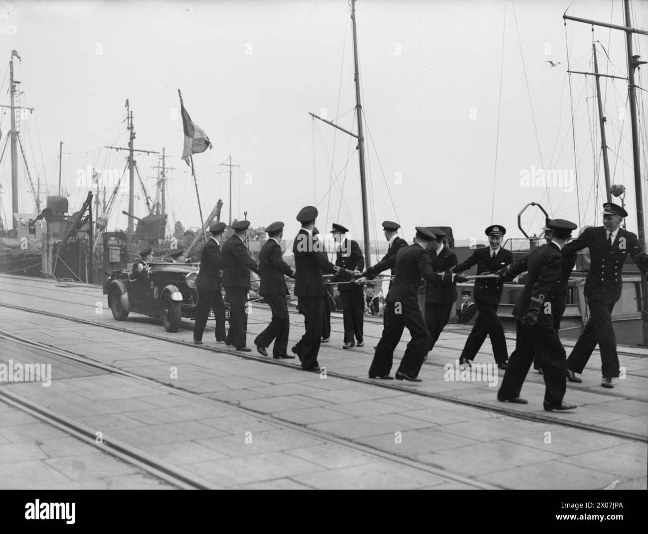 Officers from the minesweeper under Captain D.P. Evans, RN, manned drag ...