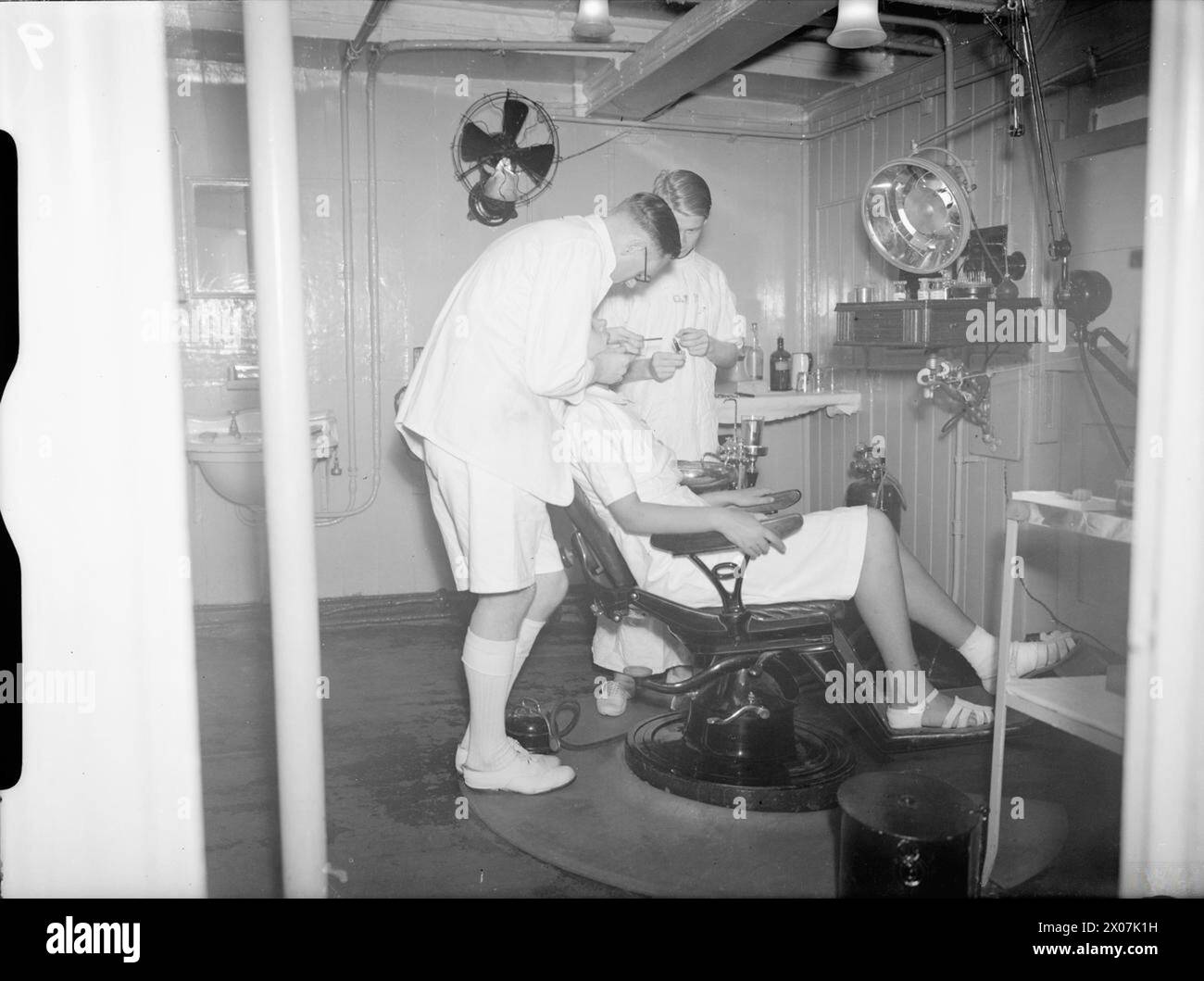 THE ROYAL NAVY DURING THE SECOND WORLD WAR - On board the hospital ship HMHS MAINE, Lake Timsah, Ismalia, Suez canal. Here a Wren is receiving treatment in the dental surgery  Royal Fleet Auxiliary, RFA Maine, Hospital Ship, (1887), Royal Navy, Women's Royal Naval Service Stock Photo