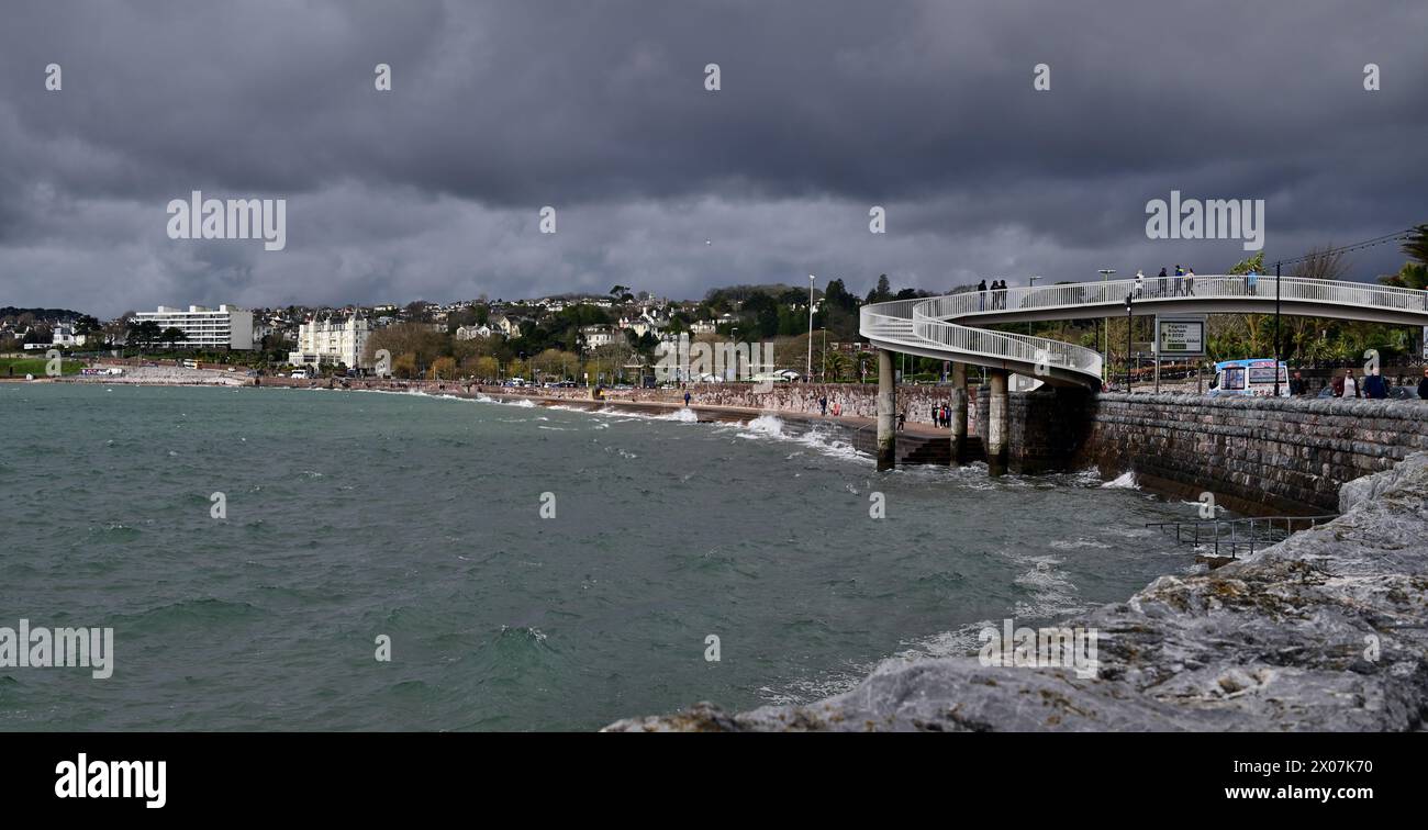 Sunshine and dark clouds over Torquay seafront as rain approaches. Stock Photo