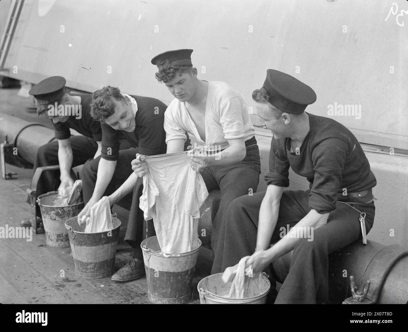An able seaman aboard HMS Anson performs daily duties, including ...