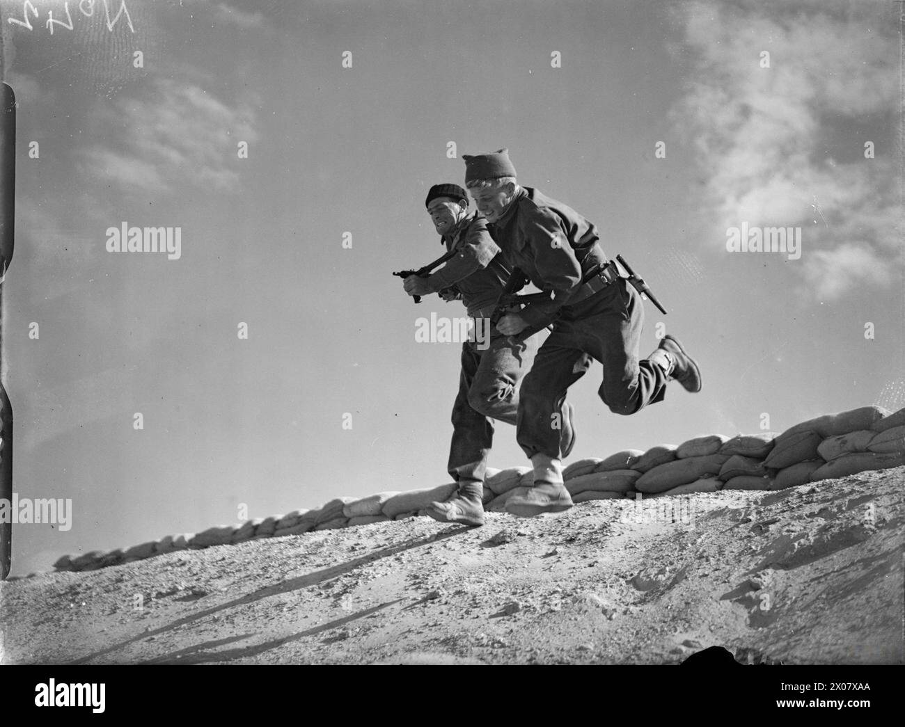 THE ROYAL NAVY DURING THE SECOND WORLD WAR - With guns raised two Naval