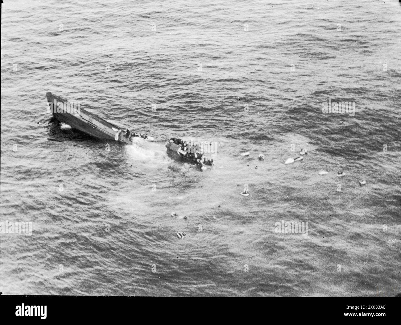 ROYAL AIR FORCE COASTAL COMMAND, 1939-1945. - Low-level oblique photograph taken from Short Sunderland Mark III, EK591 'U', of No. 422 Squadron RCAF after attacking German type VIIC submarine U-625 in the Atlantic Ocean. The crew of the U-boat take to their dinghies as the submarine sinks by the stern some one and a half hours after being depth-charged by the Sunderland  Royal Canadian Air Force, 422 Squadron, German Navy (Third Reich), U-625 Stock Photo