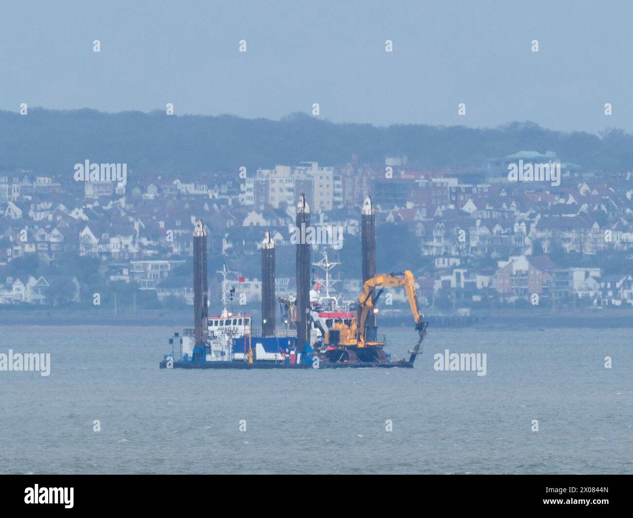 Sheerness, Kent, UK. 10th Apr, 2024. The NeuConnect Interconnector project aims to link Germany and the UK with a power cable, connecting two of Europe’s largest energy markets for the first time. Jack-up barge Abeko Server 2 was seen offshore of the Isle of Grain and Sheerness undertaking UXO (unexploded ordnance) investigation works today. Credit: James Bell/Alamy Live News Stock Photo