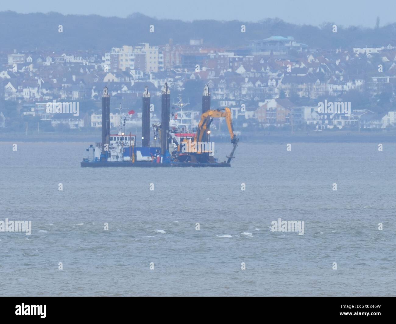 Sheerness, Kent, UK. 10th Apr, 2024. The NeuConnect Interconnector project aims to link Germany and the UK with a power cable, connecting two of Europe’s largest energy markets for the first time. Jack-up barge Abeko Server 2 was seen offshore of the Isle of Grain and Sheerness undertaking UXO (unexploded ordnance) investigation works today. Credit: James Bell/Alamy Live News Stock Photo
