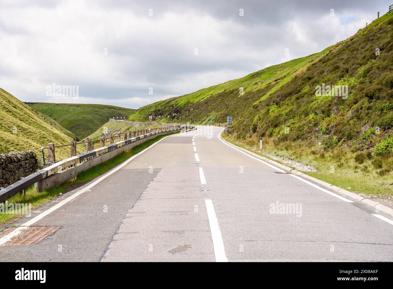 Deserted mountain pass road in England on a cloudy summer day Stock Photo