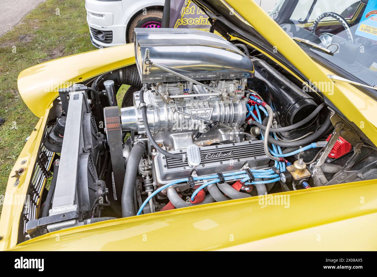 A supercharged V8 engine in a hot rod car Stock Photo Alamy