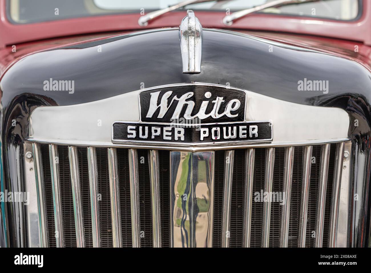 The logo bonnet and radiator grill of a White Super Power Truck. Stock Photo