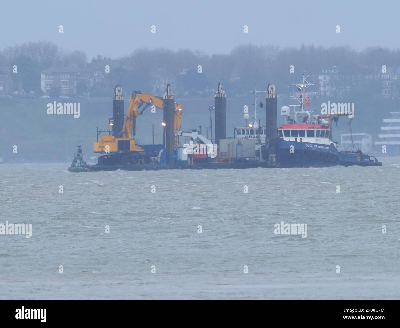 Sheerness, Kent, UK. 10th Apr, 2024. The NeuConnect Interconnector project aims to link Germany and the UK with a power cable, connecting two of Europe’s largest energy markets for the first time. Jack-up barge Abeko Server 2 was seen offshore of the Isle of Grain and Sheerness undertaking UXO (unexploded ordnance) investigation works today. (Southend on sea seen in background). Credit: James Bell/Alamy Live News Stock Photo