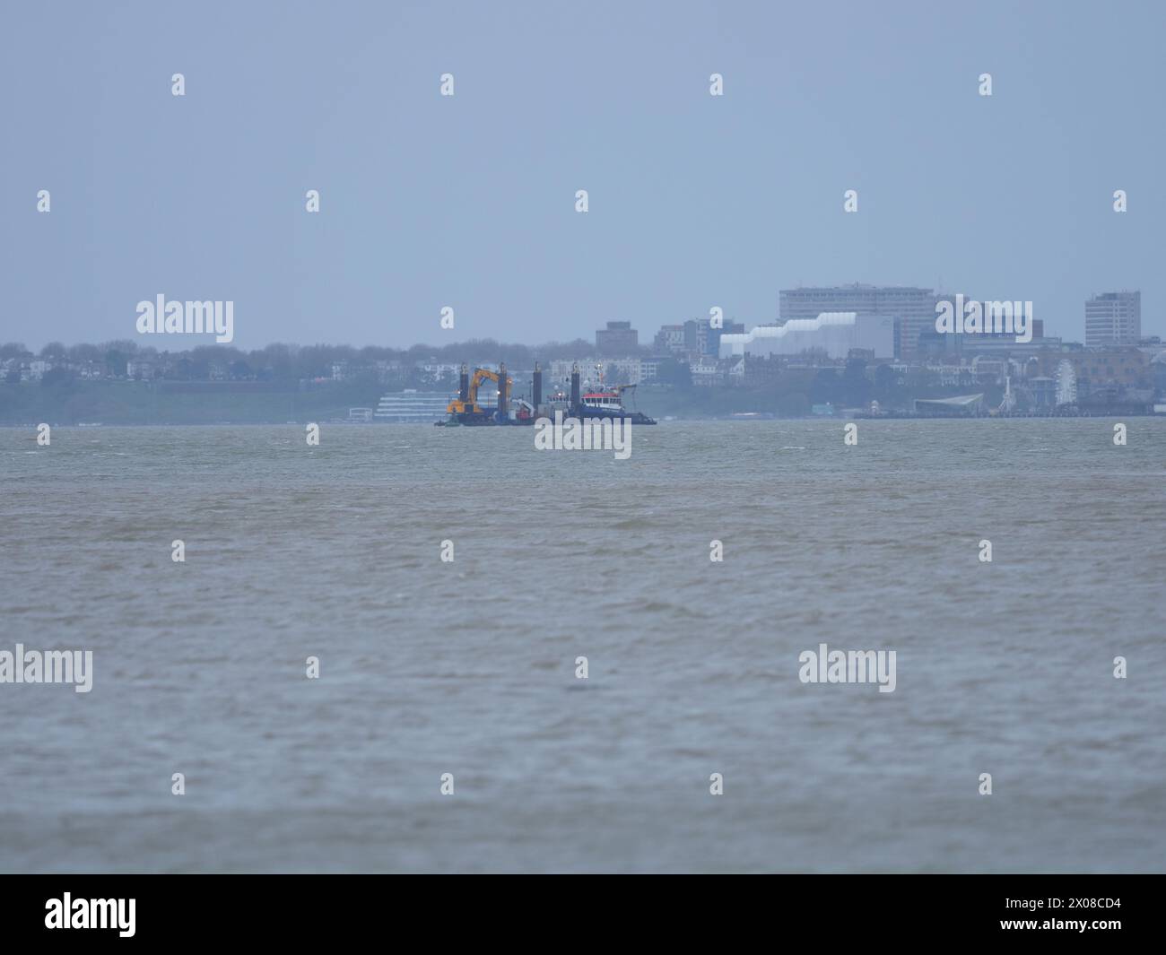 Sheerness, Kent, UK. 10th Apr, 2024. The NeuConnect Interconnector project aims to link Germany and the UK with a power cable, connecting two of Europe’s largest energy markets for the first time. Jack-up barge Abeko Server 2 was seen offshore of the Isle of Grain and Sheerness undertaking UXO (unexploded ordnance) investigation works today. (Southend on sea seen in background). Credit: James Bell/Alamy Live News Stock Photo