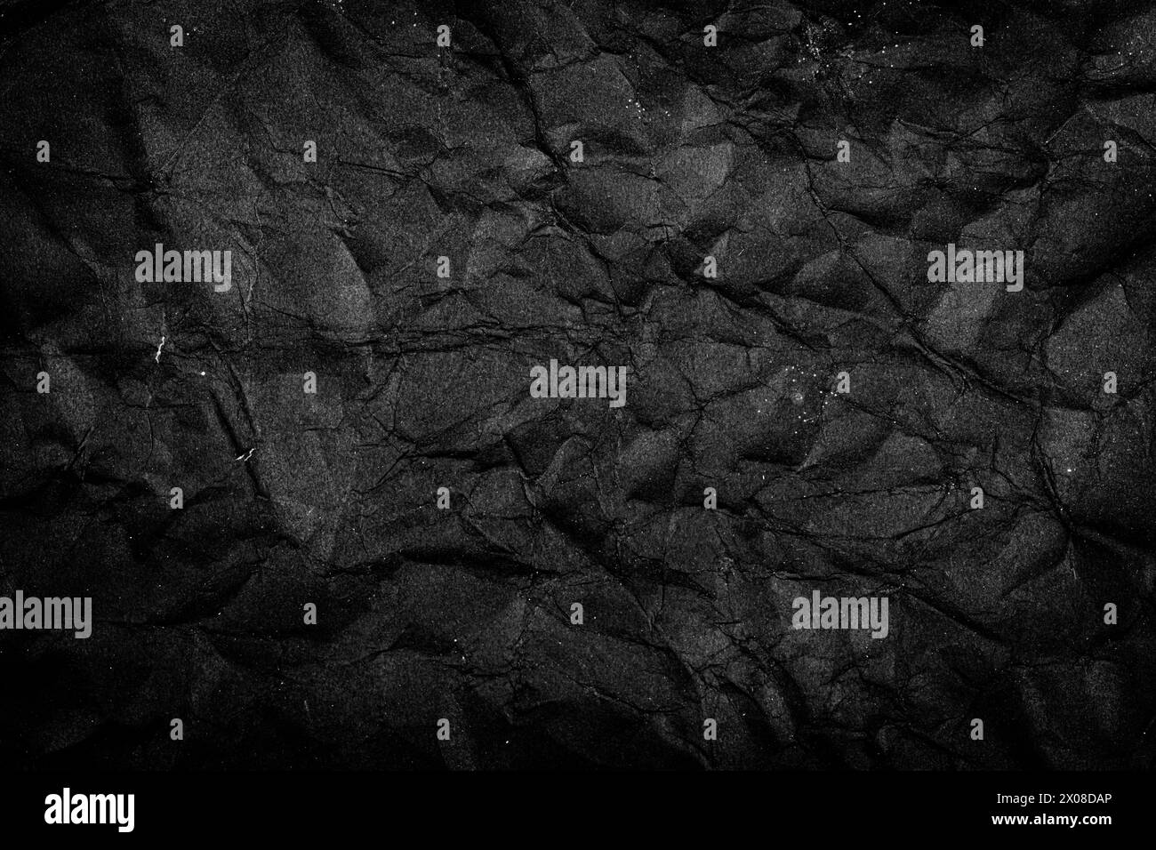 Black Paper Texture background. Crumpled Black paper abstract shape background. Stock Photo