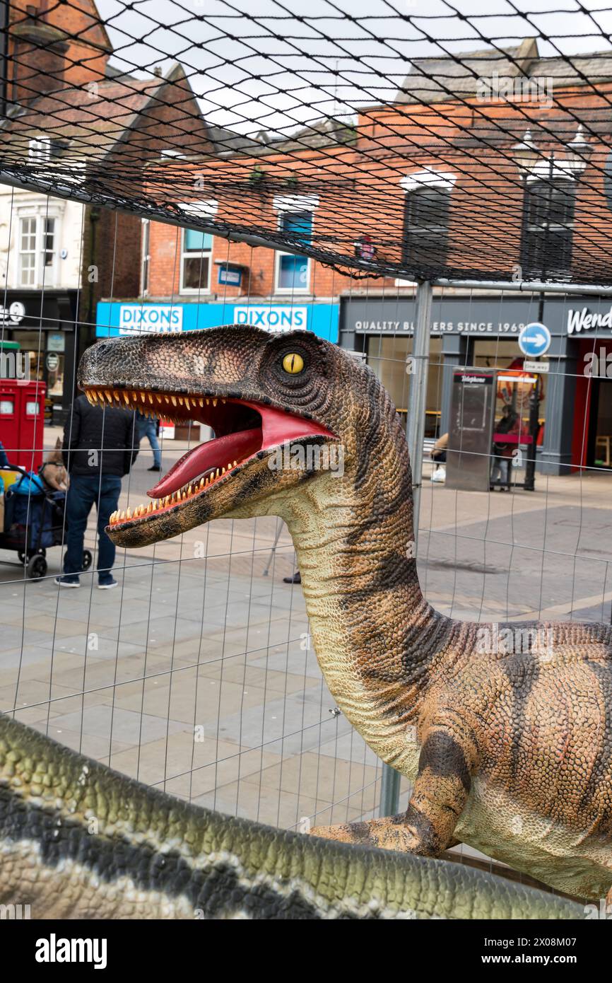 Head of model of a dinosaur, Cornhill, Lincoln City, Lincolnshire, England, UK Stock Photo