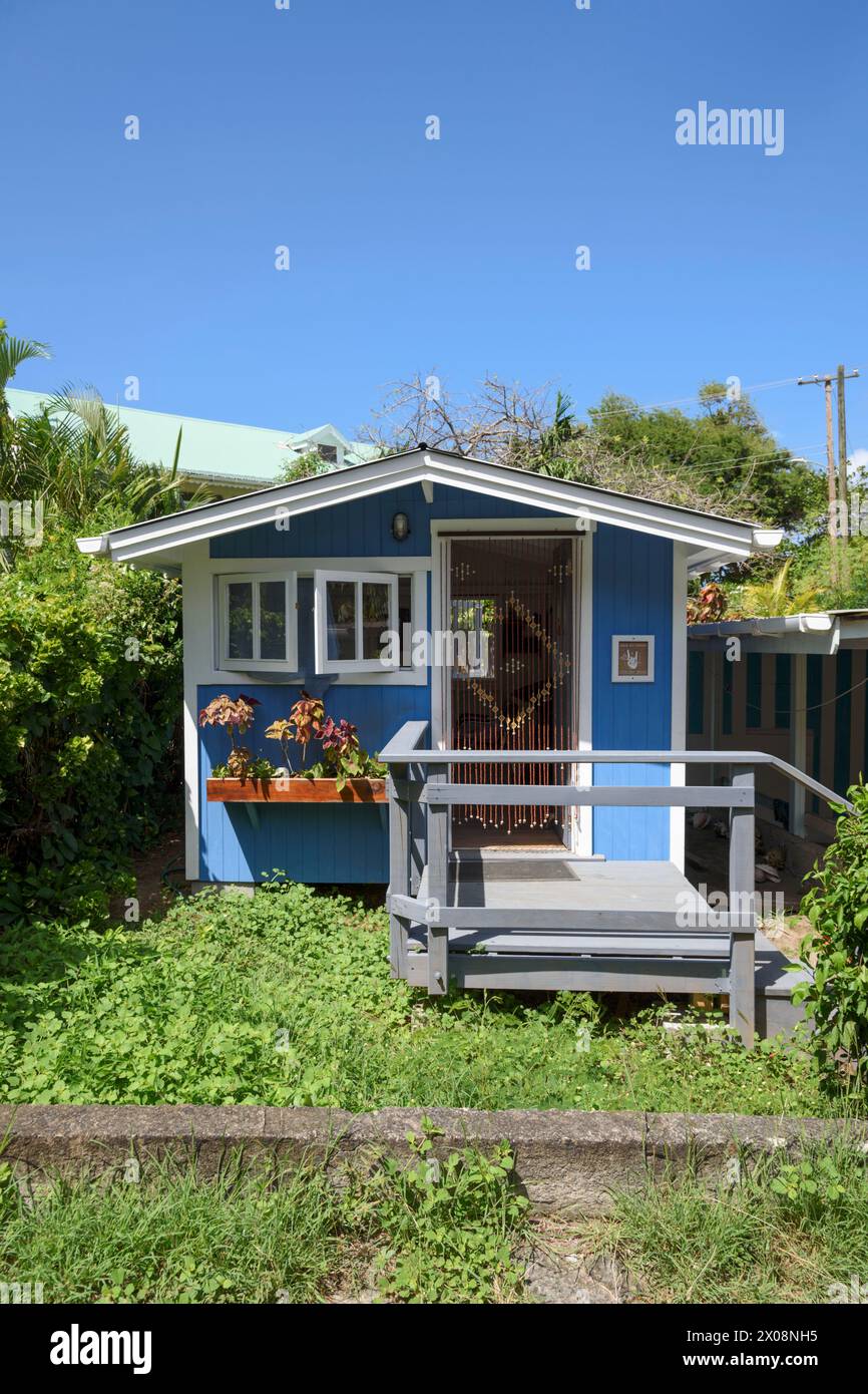 Blue painted wooden hairdresser's hut in Lower Bay, Bequia Island, St