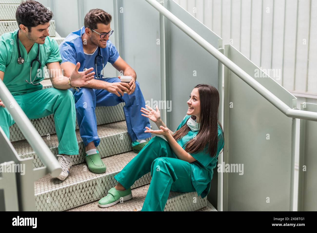 Medics having coffee and watching tablet Stock Photo