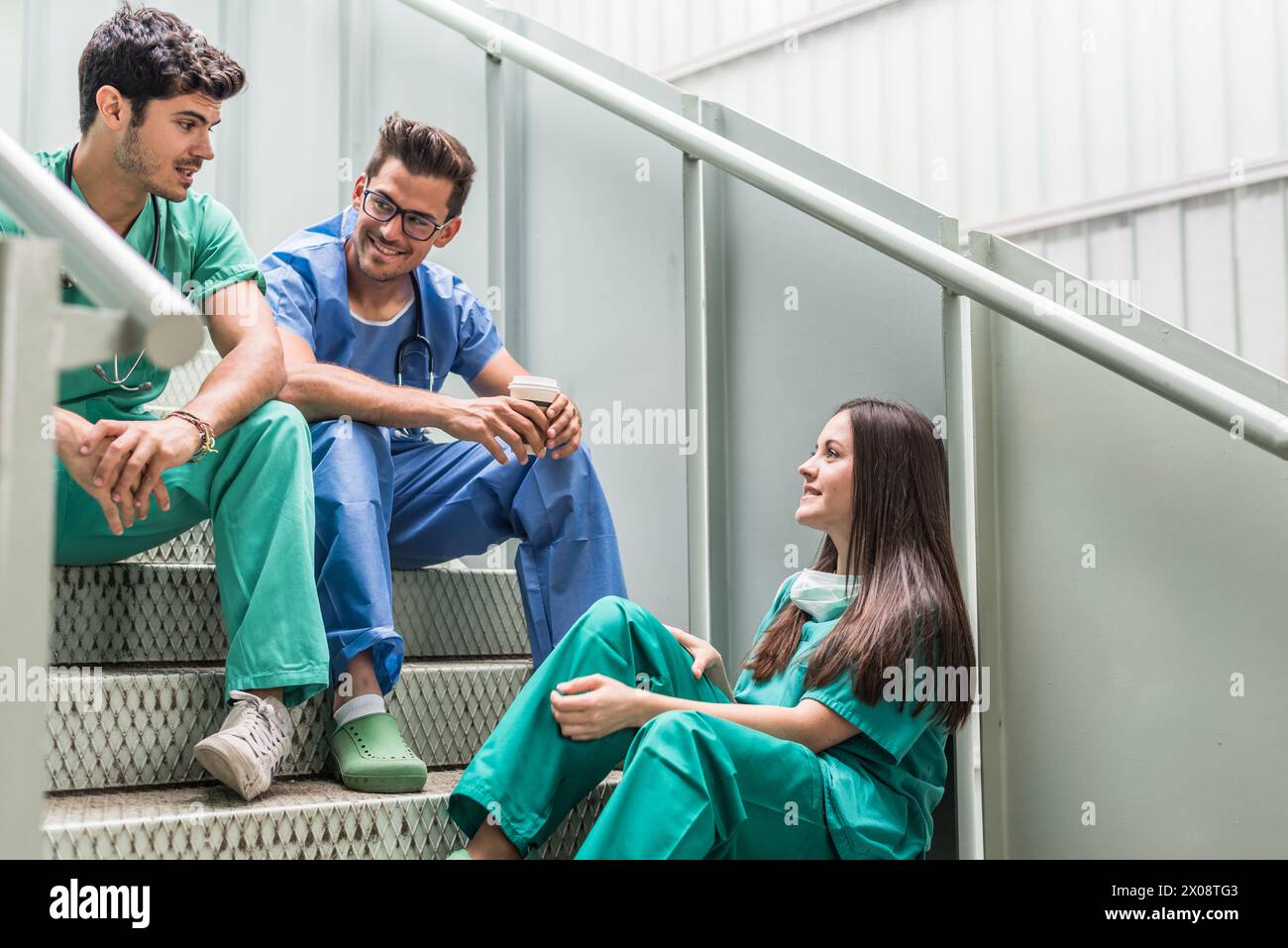 Medics having coffee and watching tablet Stock Photo