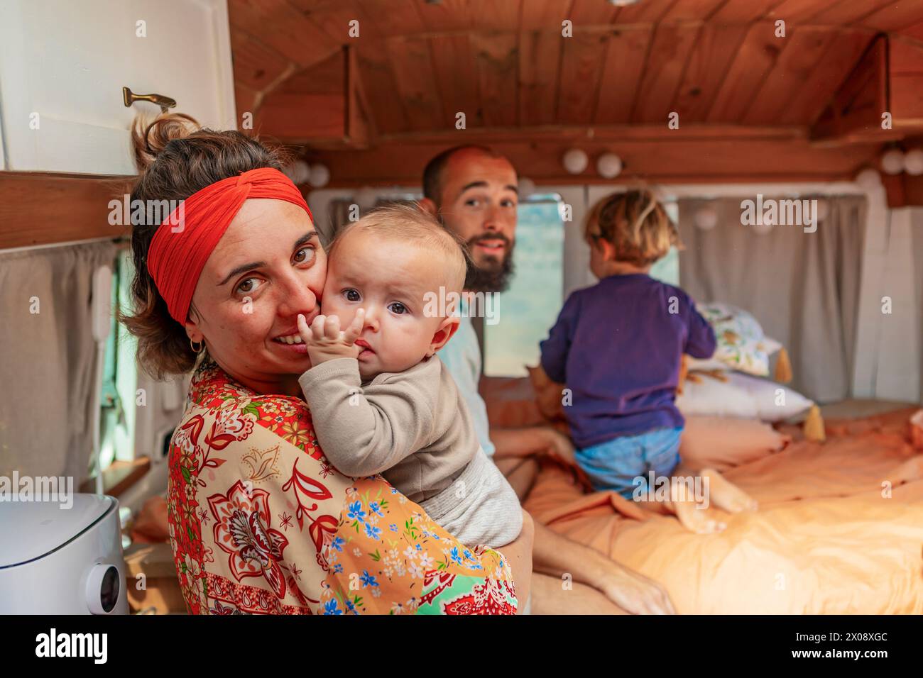 Family with young children embraces van life, adapting a vehicle into a ...