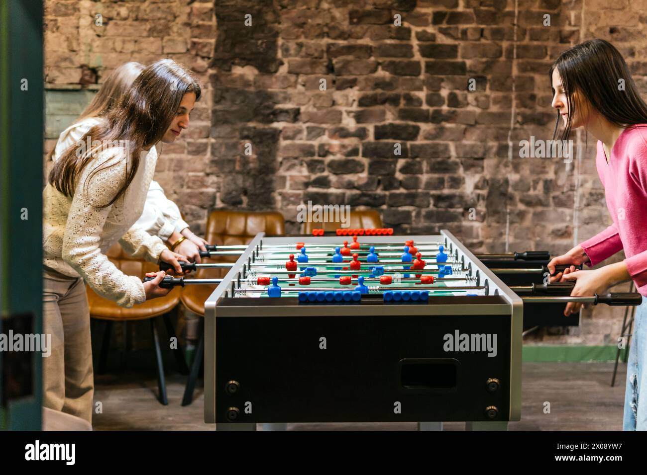 Two young women immersed hi-res stock photography and images - Alamy