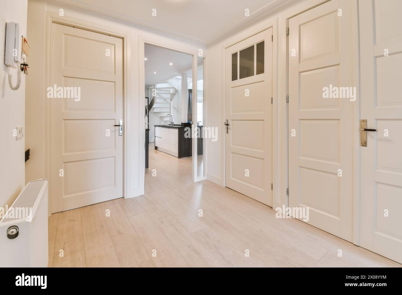 Elegantly designed modern home interior showing a hallway with multiple ...