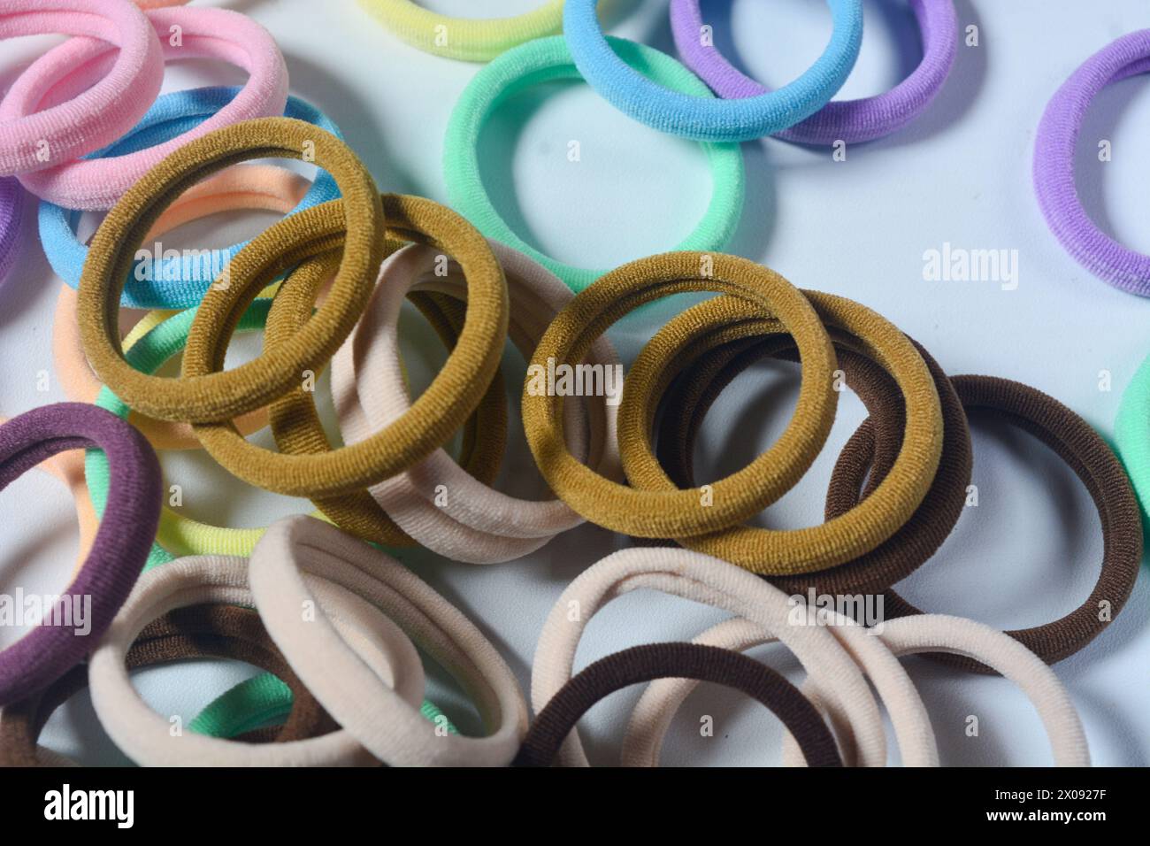 Heap of various hair ties. multicolored elastics isolated  on white background Stock Photo