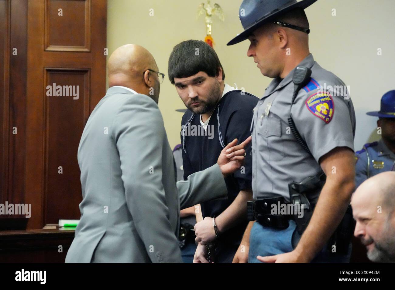 Joshua Hartfield center a former City of Richland police officer and