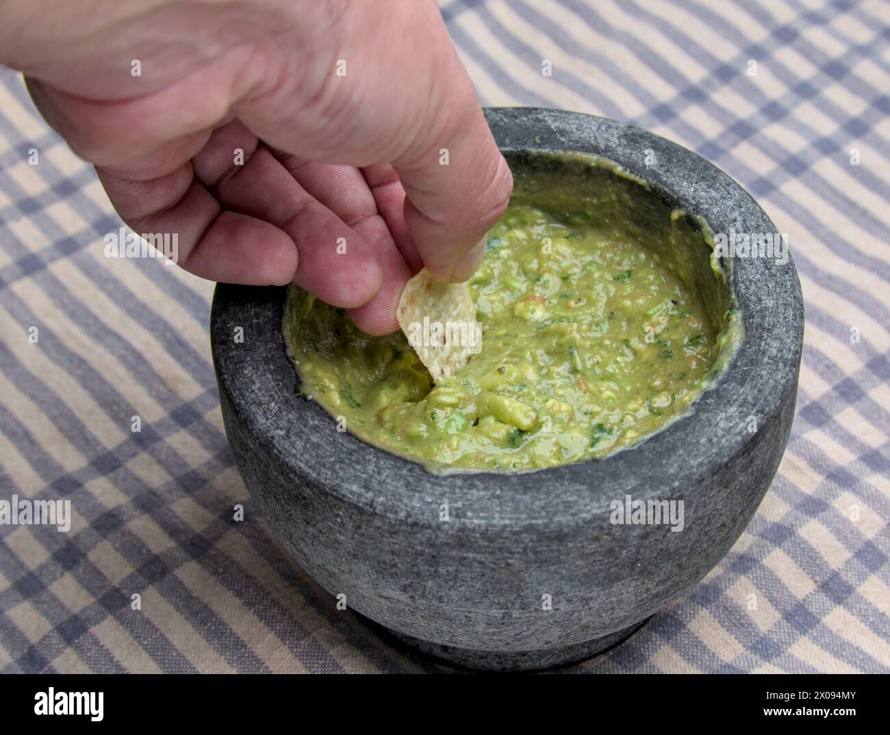 guacamole inside molcajete (traditional mexican mortar and pestle for