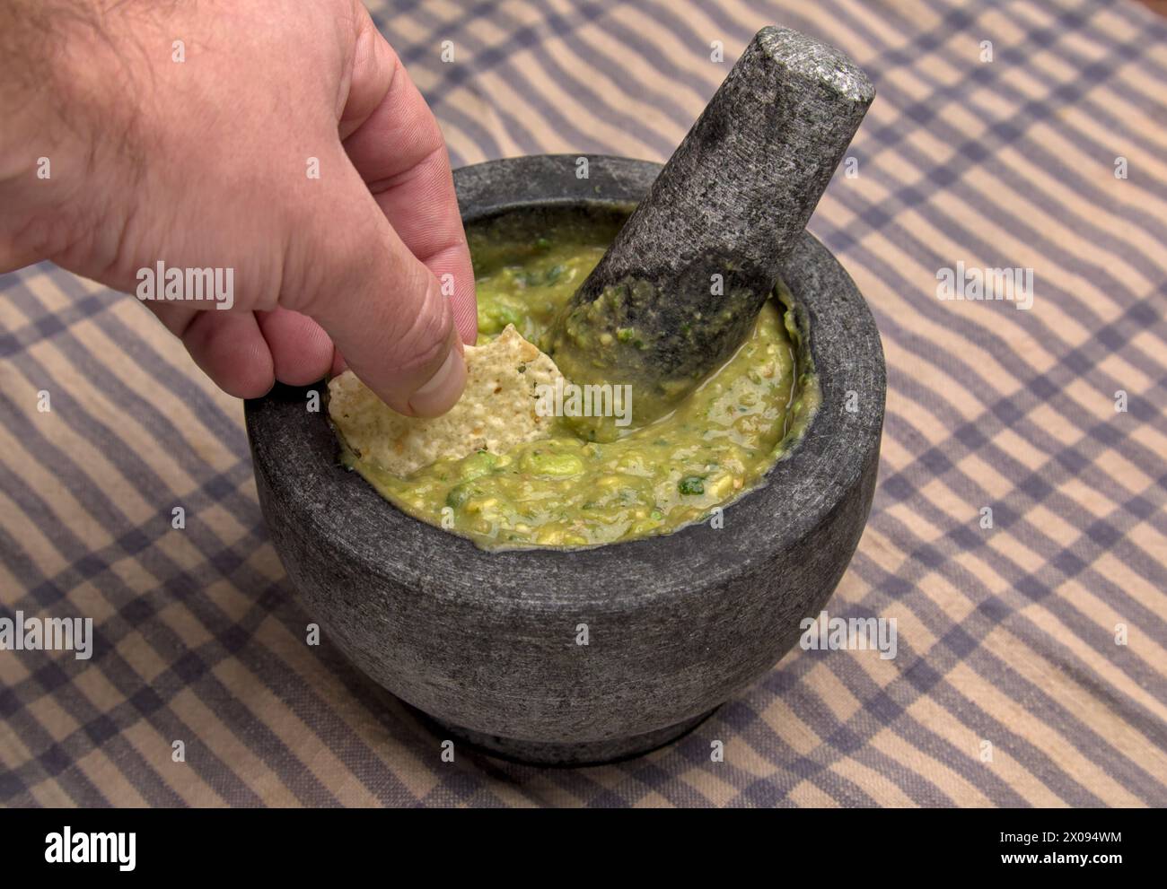 guacamole inside molcajete (traditional mexican mortar and pestle for