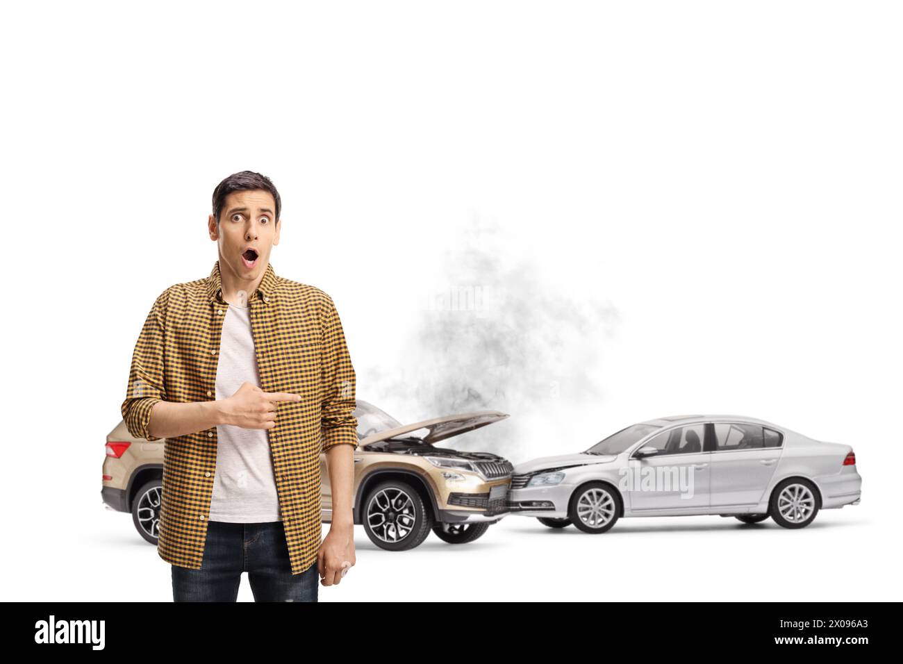 Shocked young man pointing at car collision isolated on white background Stock Photo