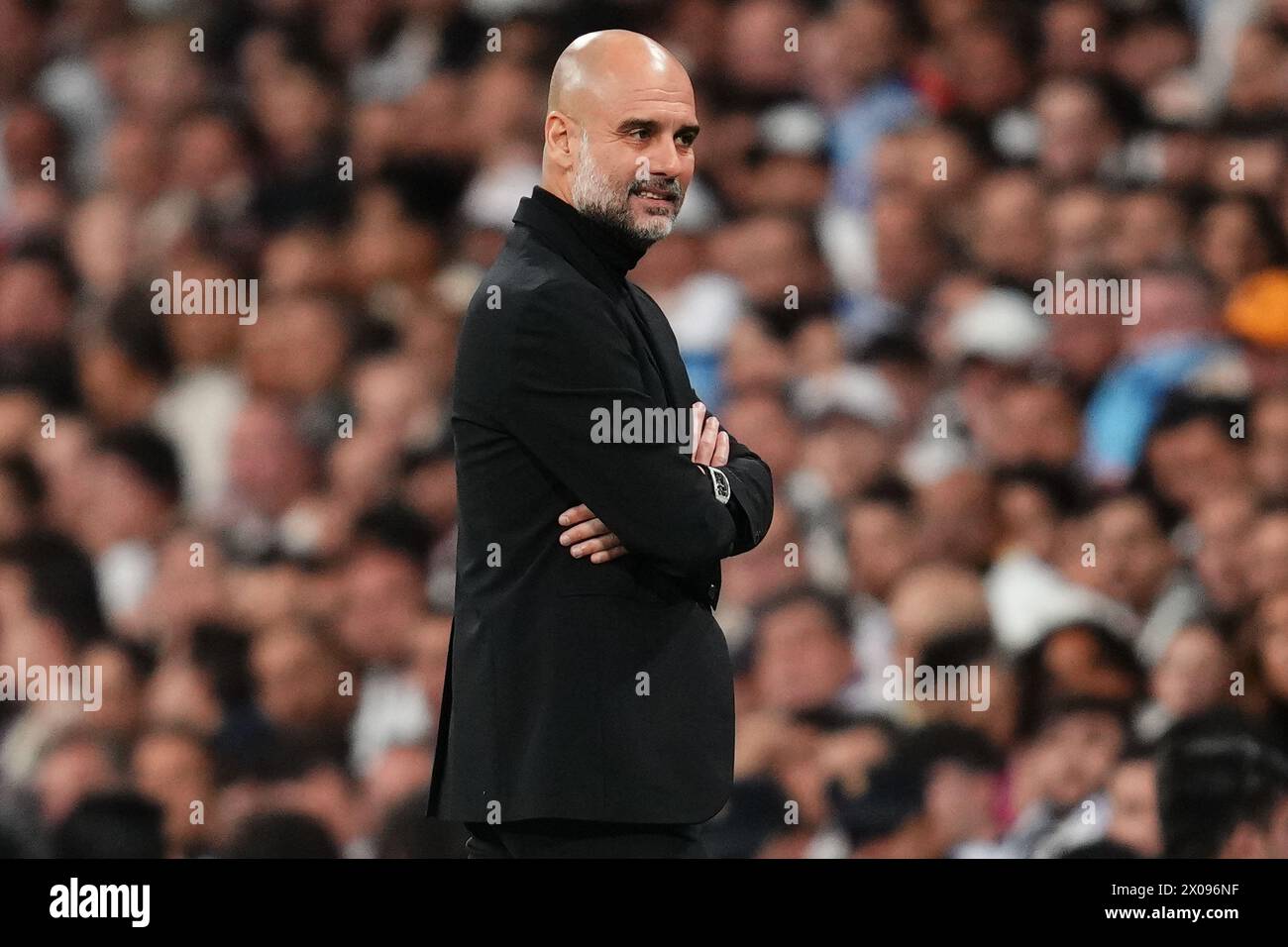 Manchester City head coach Josep Guardiola during the UEFA Champions League match, Quarter-finals, first leg, between Real Madrid and Manchester City played at Santiago Bernabeu Stadium on April 9, 2024 in Madrid Spain. (Photo by Bagu Blanco / PRESSINPHOTO) Stock Photo
