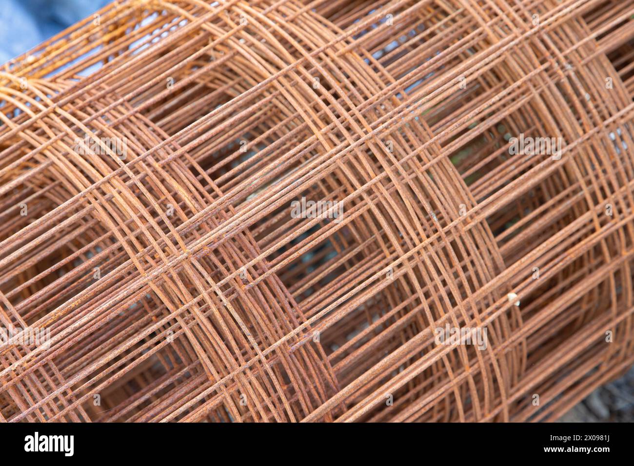 Roll of steel mesh for construction in oxidation state. Abstract image. Stock Photo