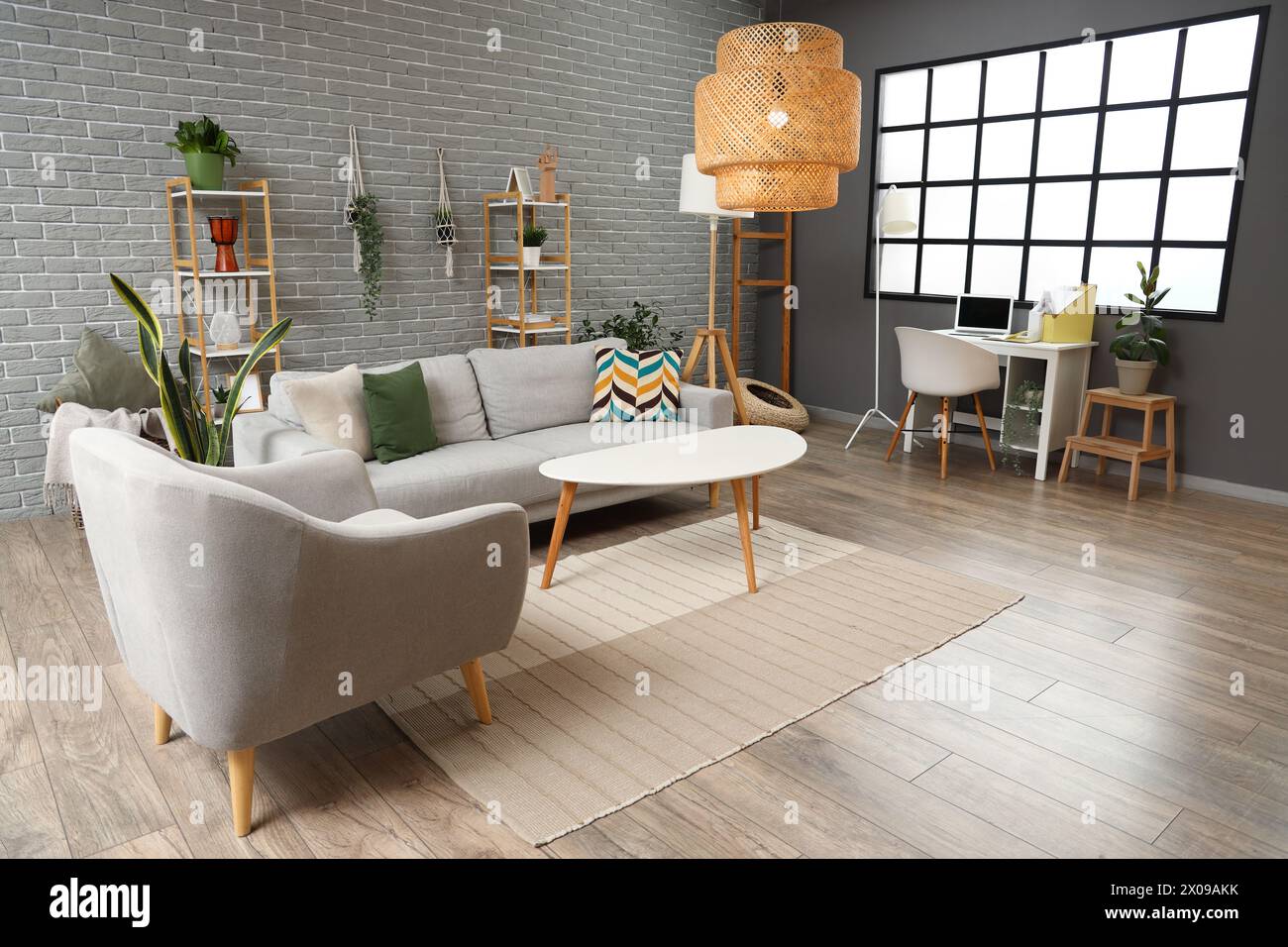 Interior of living room with grey sofa, armchair, coffee table and lamp ...