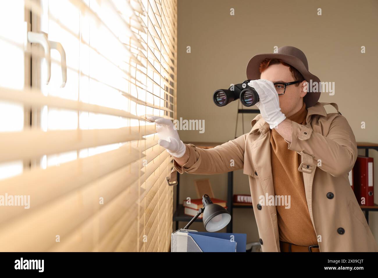 Man binoculars spying window hi-res stock photography and images - Alamy